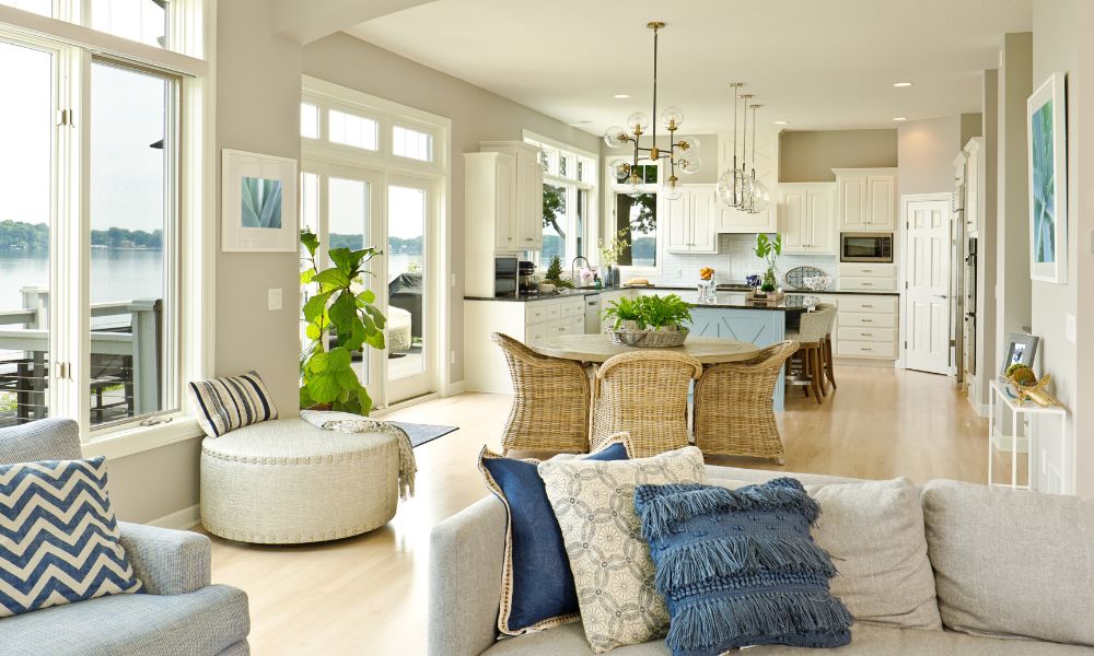 Open concept living room arranged into distinct seating and dining zones