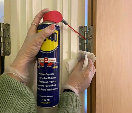 Lubricate door hinges