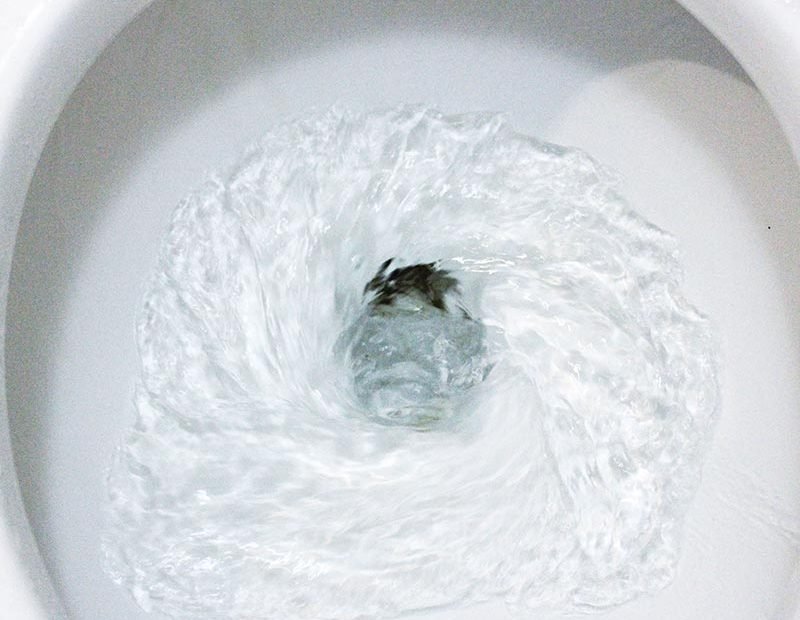 Flush down flushing toilet