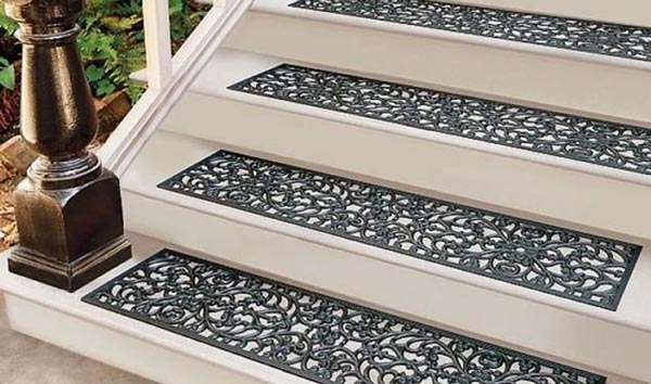 Outdoor stone staircase designed with textured treads and a handrail