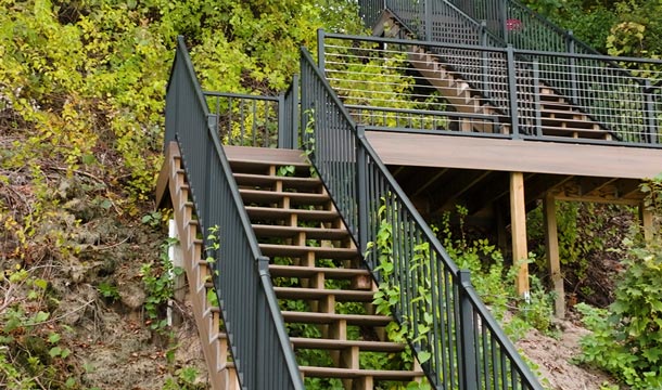 Wooden outdoor staircase with open risers and a protective finish