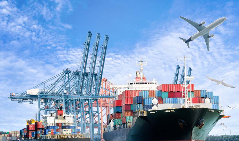 Cargo containers moving through an international shipping terminal