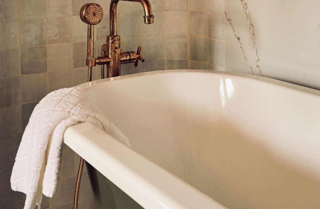 Modern bathtub area with clear circulation and bathroom lighting