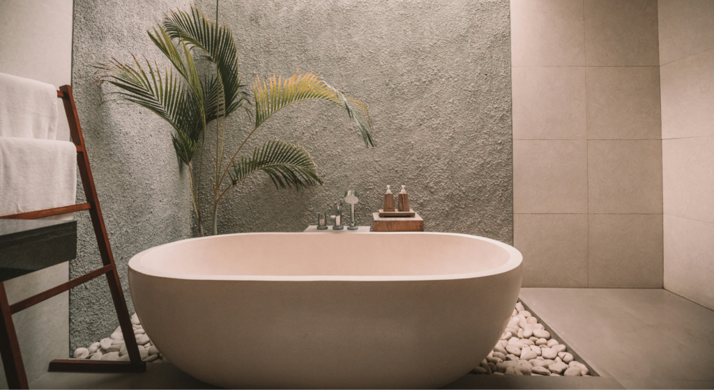 Jetted bathtub in a residential bathroom with accessible controls and surrounding surfaces