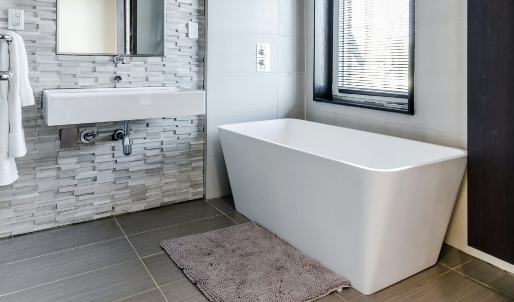 Close view of whirlpool bathtub jets and acrylic bathing surface