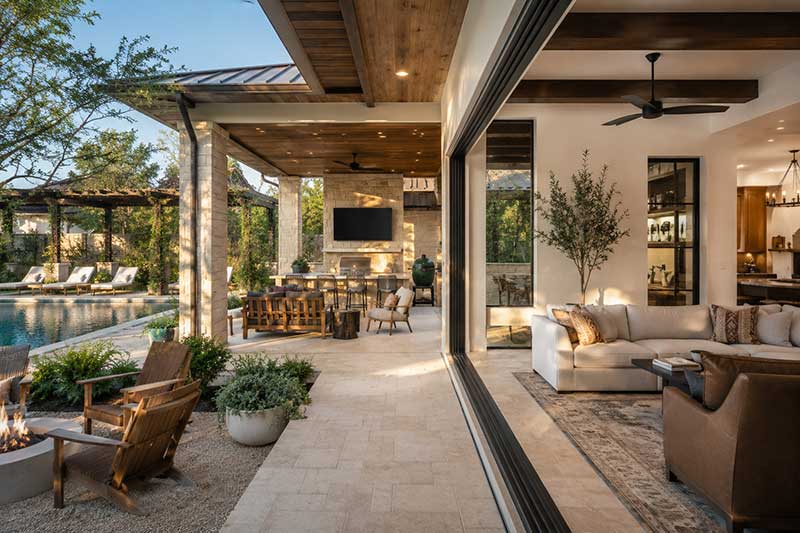 shaded Texas outdoor living area connected to a modern home