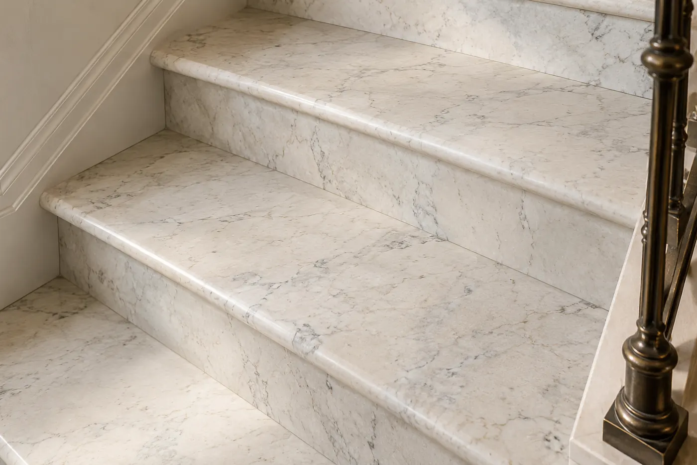 Honed marble stair surfaces showing natural veining and neatly fitted edges