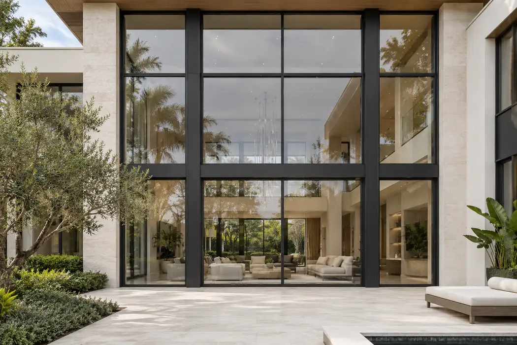 Contemporary coastal facade with a multi-panel aluminum window assembly
